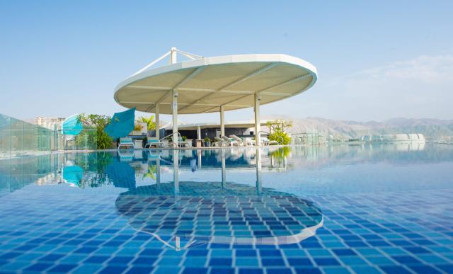 GMM Hero Image - Hotel Rooftop Pool with Mountain and SKy view